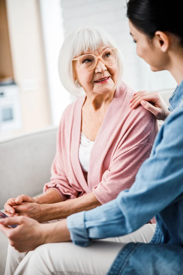 midassistedlivingpage Adult daughter talking to happy assisted living resident in Conroe
